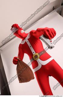 28 2019 01 JOEL ADAMSON CHRISTMASVILLAIN WITH GUN AND BAG